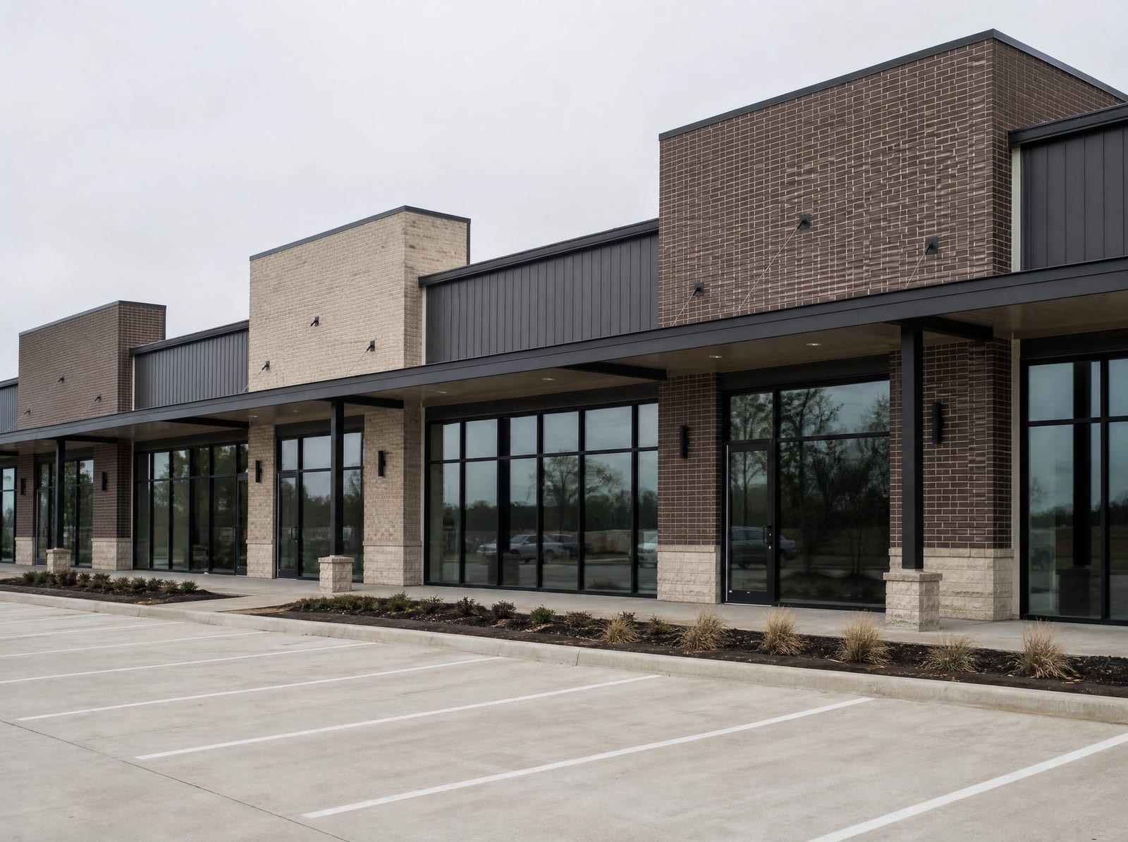 A modern Texas multi-tenant commercial building with glass storefronts, a covered walkway, and a clean parking lot, available for commercial lease