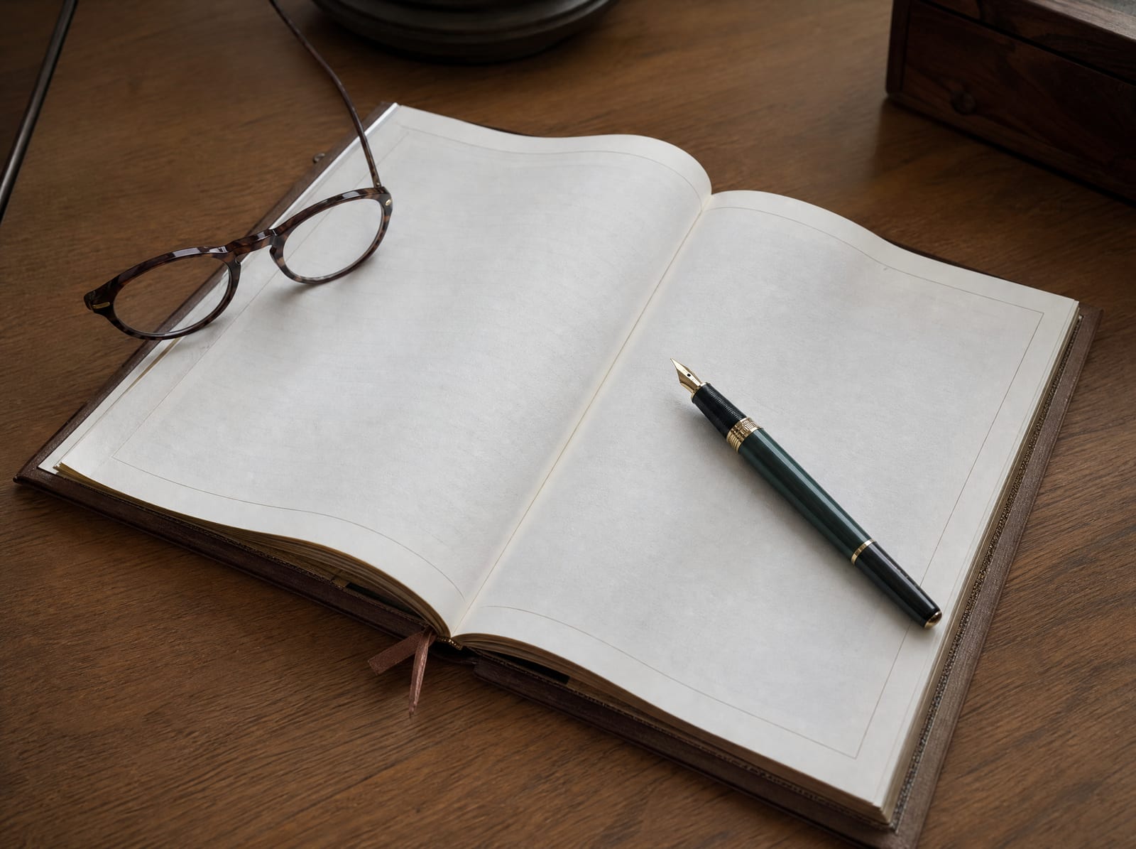 A bound last will and testament lying open on a warm wood desk with a fountain pen resting on the page and reading glasses beside it, the document at the center of a will contest